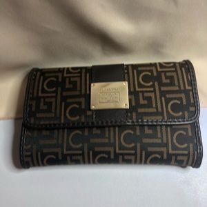 FREE W/purchase of $50 and up! 
Liz Claiborne Compact Wallet